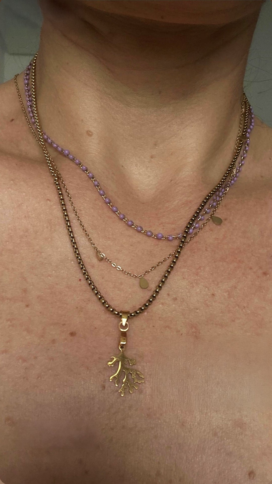 "The gold coral pendant is stunning, and the mauve resin pearl necklace with the Amethyst charm feels magical. I love layering them — so unique and vibrant!" ✧ YANA