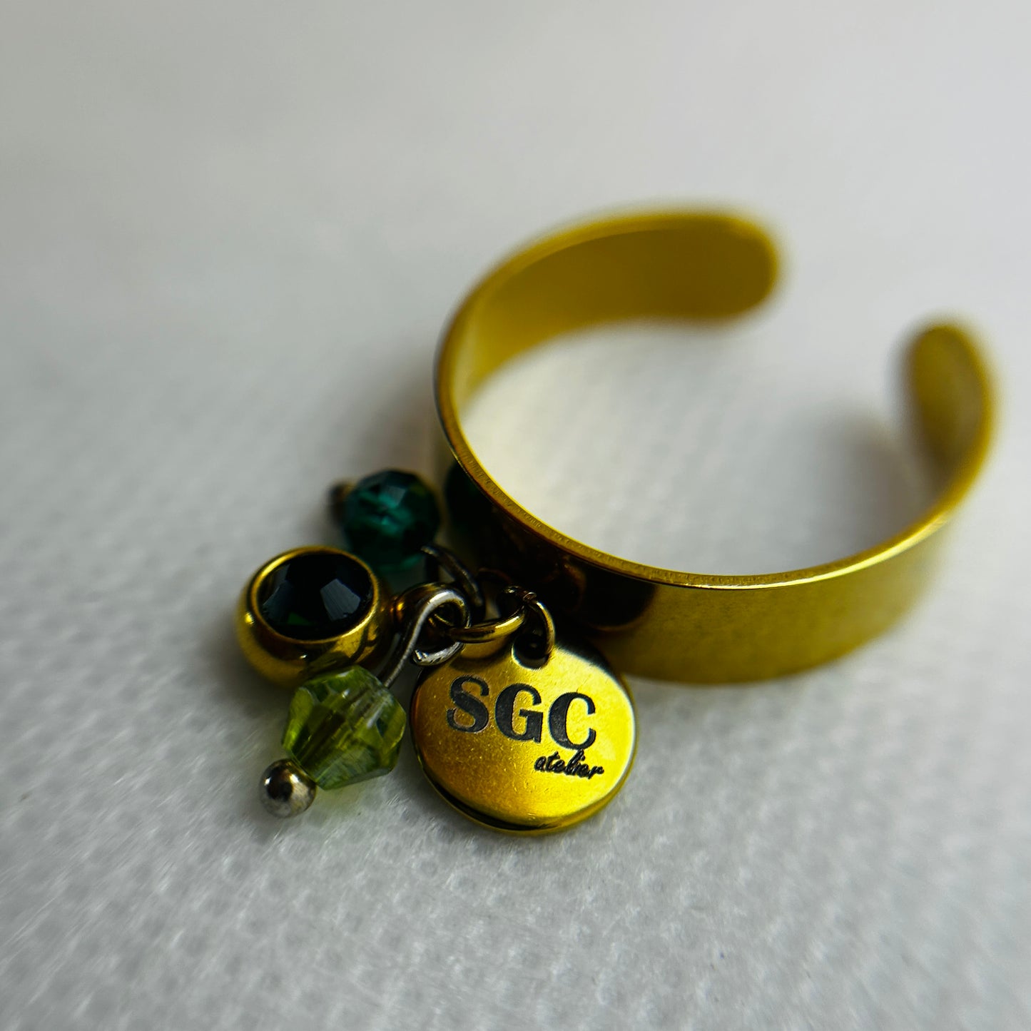 Gold ring with charms